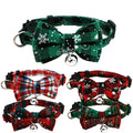 Five Christmas cat collars with snowflake bow ties and bells in dark green, red tartan, red and black check, black and red sparkle, and green and red designs