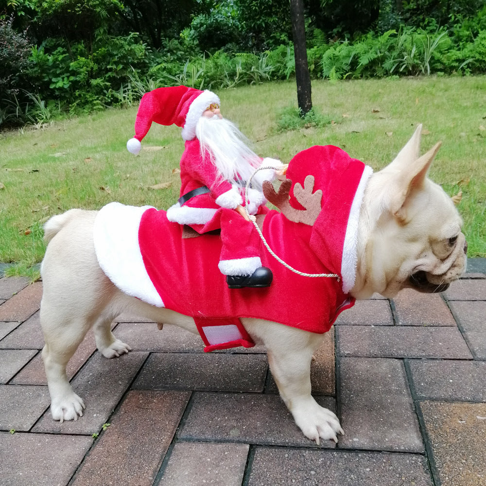 French bulldog wearing a red Santa Riding Reindeer Christmas costume with a plush Santa rider on its back