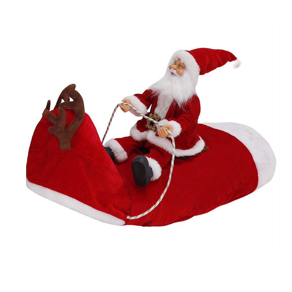 Santa Claus figure sitting in the red sack of the Santa Riding Reindeer dog costume