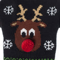 Close-up of a knitted Rudolph reindeer face with red pom-pom nose and snowflakes on a black Christmas pet sweater