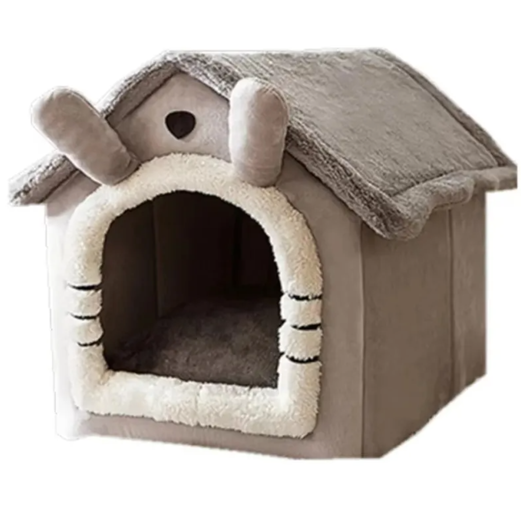 Cat resting inside warm pet house