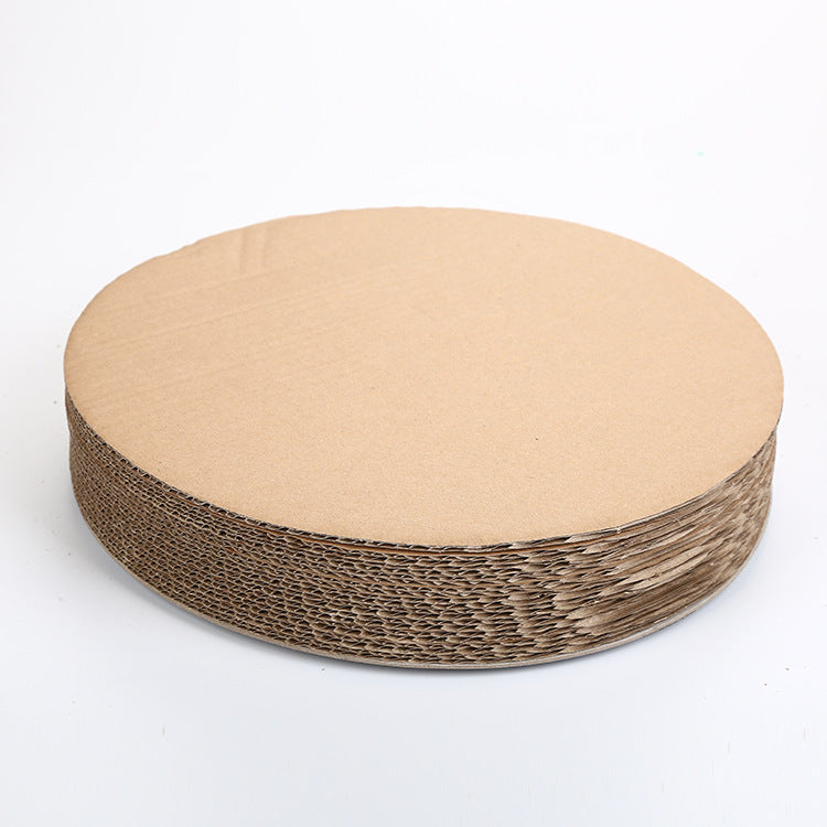 Cat scratching claws on corrugated cardboard board