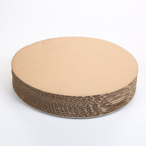 Cat scratching claws on corrugated cardboard board