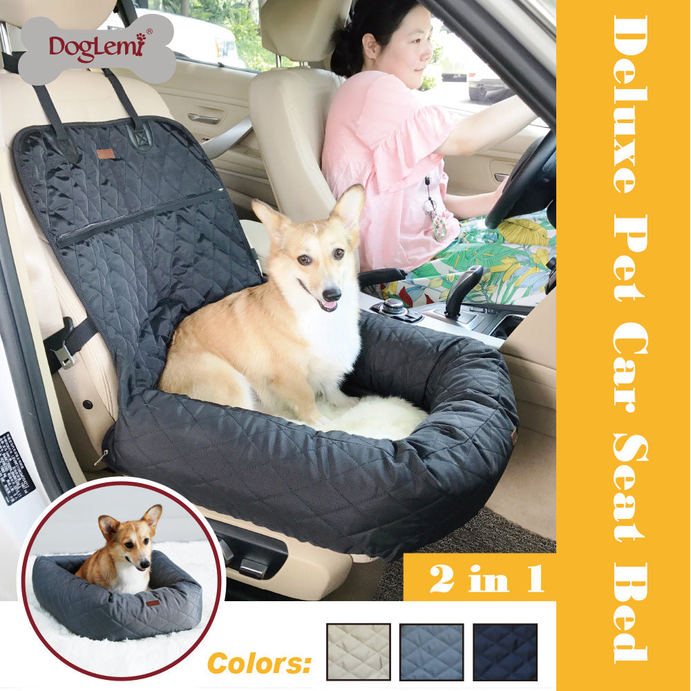 Dog resting in pet car bed on back seat